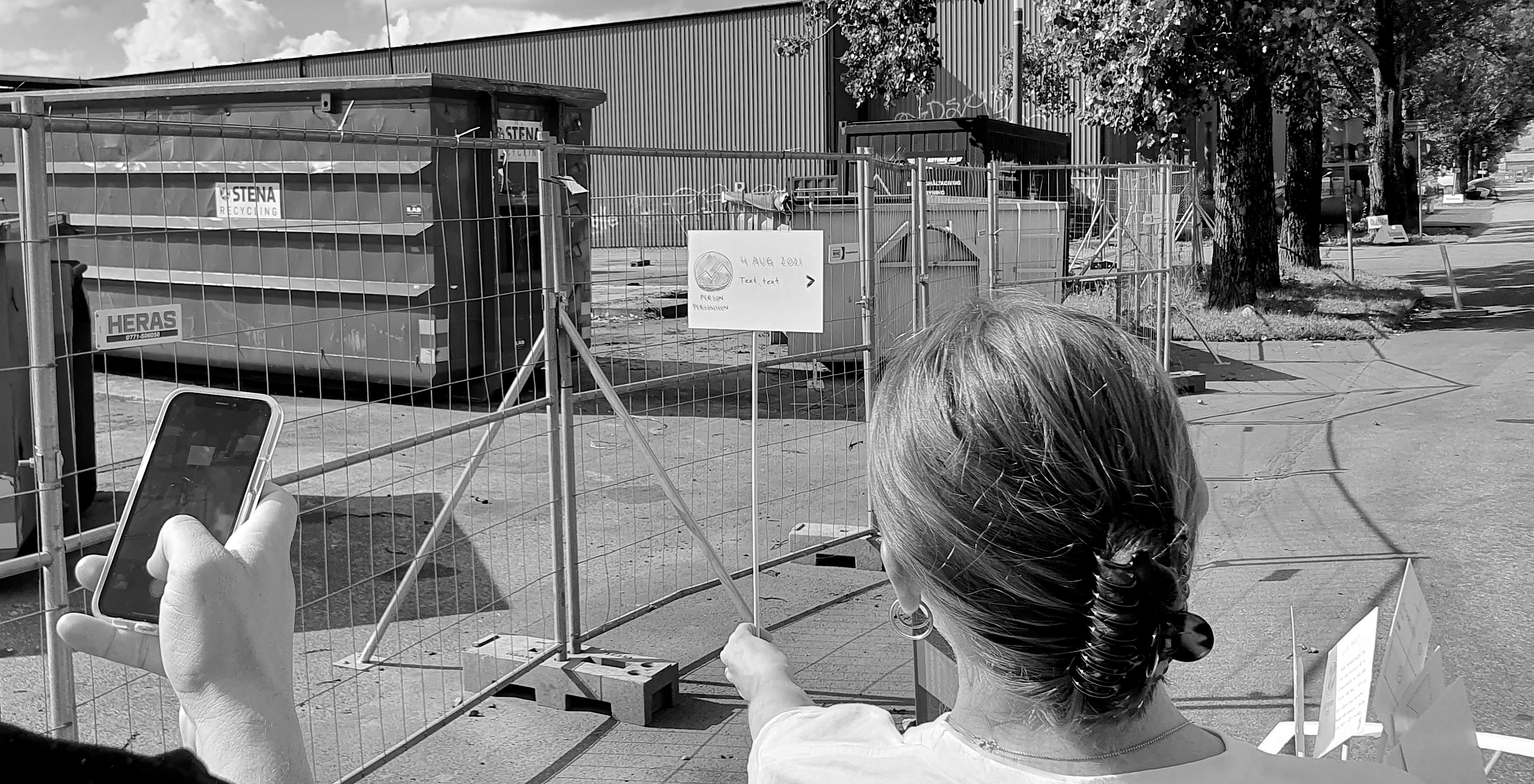 On-site workshop with Josef at Ringön — acting through the Augment Your City user scenario at the location of the burned-down warehouse, using paper signs as props for AR symbols.